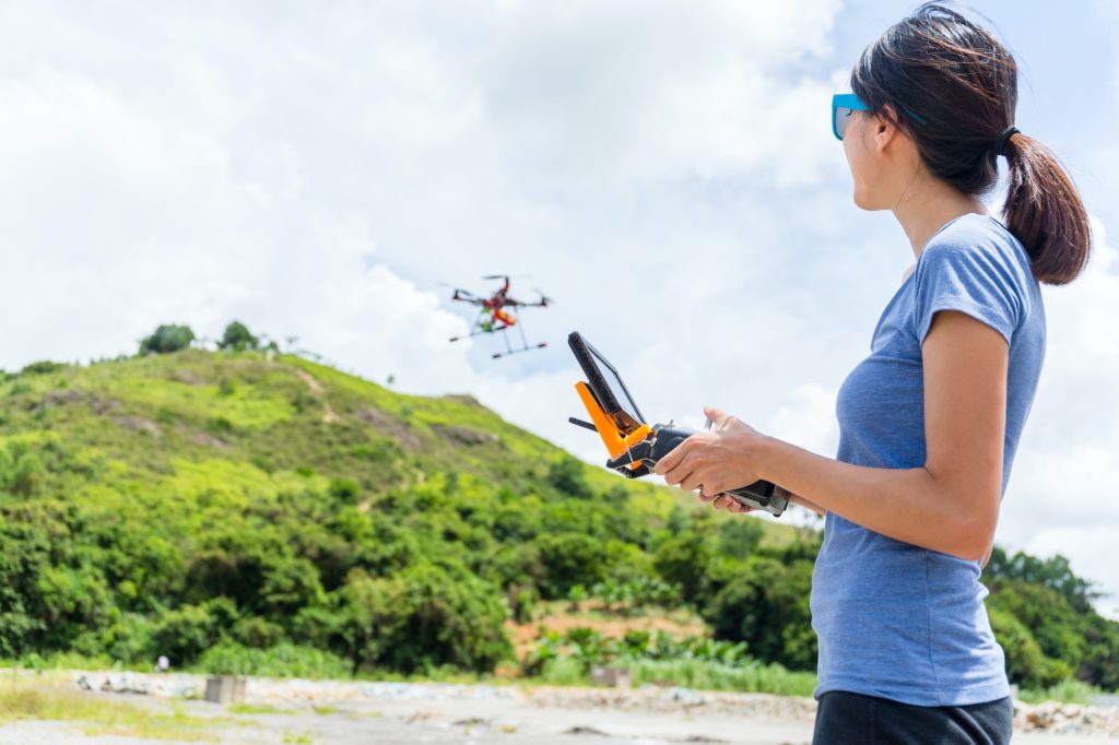Woman playing drone